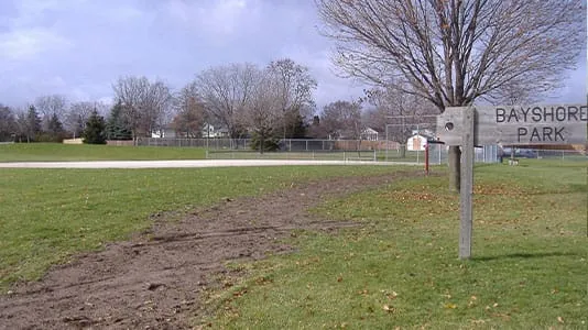 Bayshore Park sign and grass